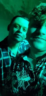 Green-tinted image of two people with patterned shirts.