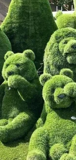 Green topiary animals shaped like bears and lions in a garden setting.