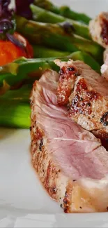 Grilled steak with asparagus and cherry tomatoes on a plate.