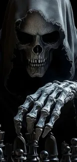 Grim Reaper in hood playing chess with skeletal hand.