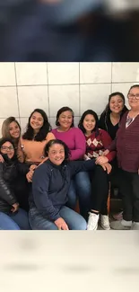 Group of friends posing in a kitchen.