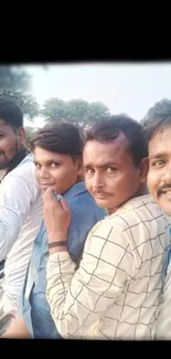 Four friends riding a motorbike together, outdoors