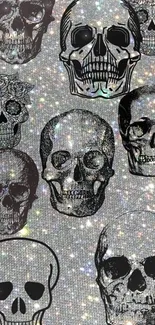 Grunge style black skulls with a glittery gray background.