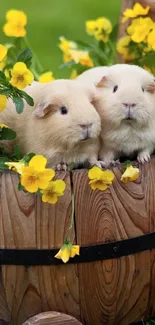 Two cute guinea pigs in a floral wooden barrel.