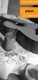 Guitar resting on lace table with coffee and books.