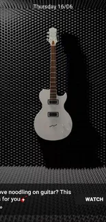 White guitar in a black acoustic room wallpaper.