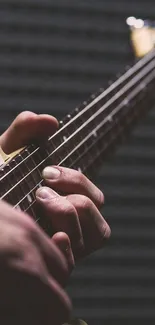 Close-up of hands playing a guitar with visible strings.