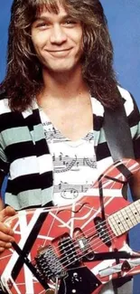 Guitarist playing a red and white patterned guitar against a blue background.