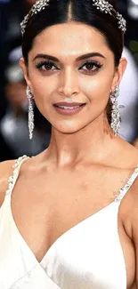 Woman in elegant white evening gown, stylish and poised.