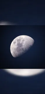 Half moon in dark blue night sky wallpaper.