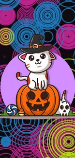 Cartoon cat in witch hat on pumpkin with colorful circle backdrop.