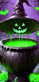 Vibrant Halloween wallpaper with a glowing green cauldron and pumpkins.