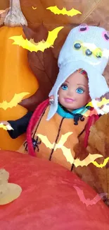 Doll in Halloween-themed attire with pumpkins and bats.