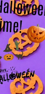 Purple Halloween wallpaper with pumpkins and witches.