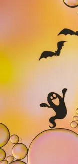 Halloween wallpaper with ghost and bats, featuring vibrant orange and yellow hues.