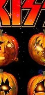 Halloween wallpaper with Kiss band inspired pumpkin carvings.