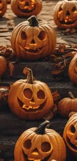 A group of carved pumpkins on steps for Halloween.