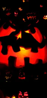 Glowing Halloween pumpkins in a dark, spooky design perfect for festive ambiance.