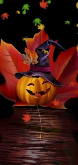 Halloween wallpaper with pumpkin in witch hat and autumn leaves.