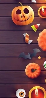 Halloween-themed wallpaper with pumpkins and candles.