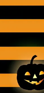 Halloween wallpaper with pumpkin and orange-black stripes.