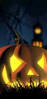 Glowing jack-o'-lantern in spooky night wallpaper.