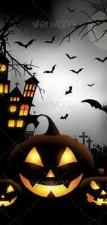 Halloween wallpaper with pumpkins, bats, and a haunted house.