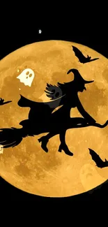 Silhouetted witch flying across a full orange moon with bats and ghosts.