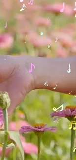 Hand touching flowers with musical notes in the air.