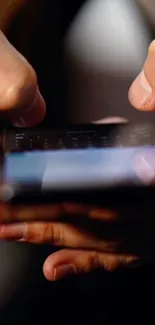 Close-up of hands holding a smartphone.