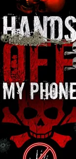 Bold skull and crossbones phone wallpaper with 'Hands Off My Phone' message.