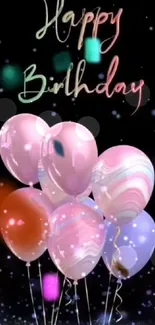 Colorful Happy Birthday balloons with confetti on a dark background.