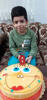 Smiling child with colorful birthday cake.