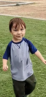 A happy child running on vibrant green grass.