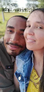 Smiling couple enjoying a sunny day in the park with love in the air.