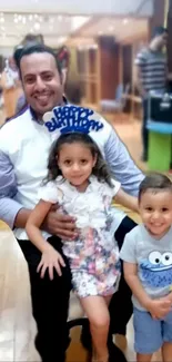 A father celebrating birthday with children.