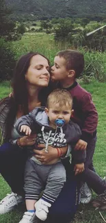 A family enjoying nature in a lush, green landscape.