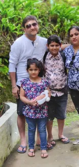 Family enjoying outdoors surrounded by greenery.