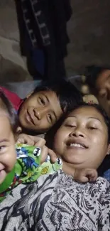 Family shares happy moment together in cozy setting.