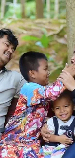 A family enjoys a joyful and playful moment together in a lush green setting.