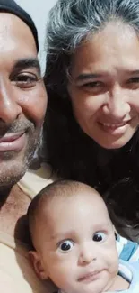 Smiling family with baby capturing joyful moments.