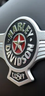 Harley Davidson emblem on matte black surface.