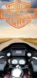 Harley-Davidson motorcycle on open road with scenic sky.