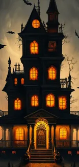 Eerie Halloween mobile wallpaper with haunted house and bats.