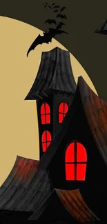 Spooky haunted house with bats and red windows under a dark green sky.