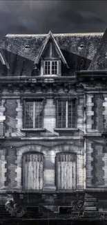 Dark gray haunted mansion wallpaper with eerie nighttime atmosphere.