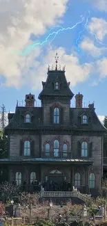 Haunted mansion with lightning under stormy sky.