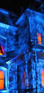 Haunted house in blue and orange hues at night, eerie atmosphere.