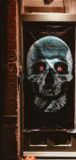 Eerie skull with glowing eyes on a dark door.