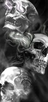 Mobile wallpaper featuring smoky skulls against a dark background.